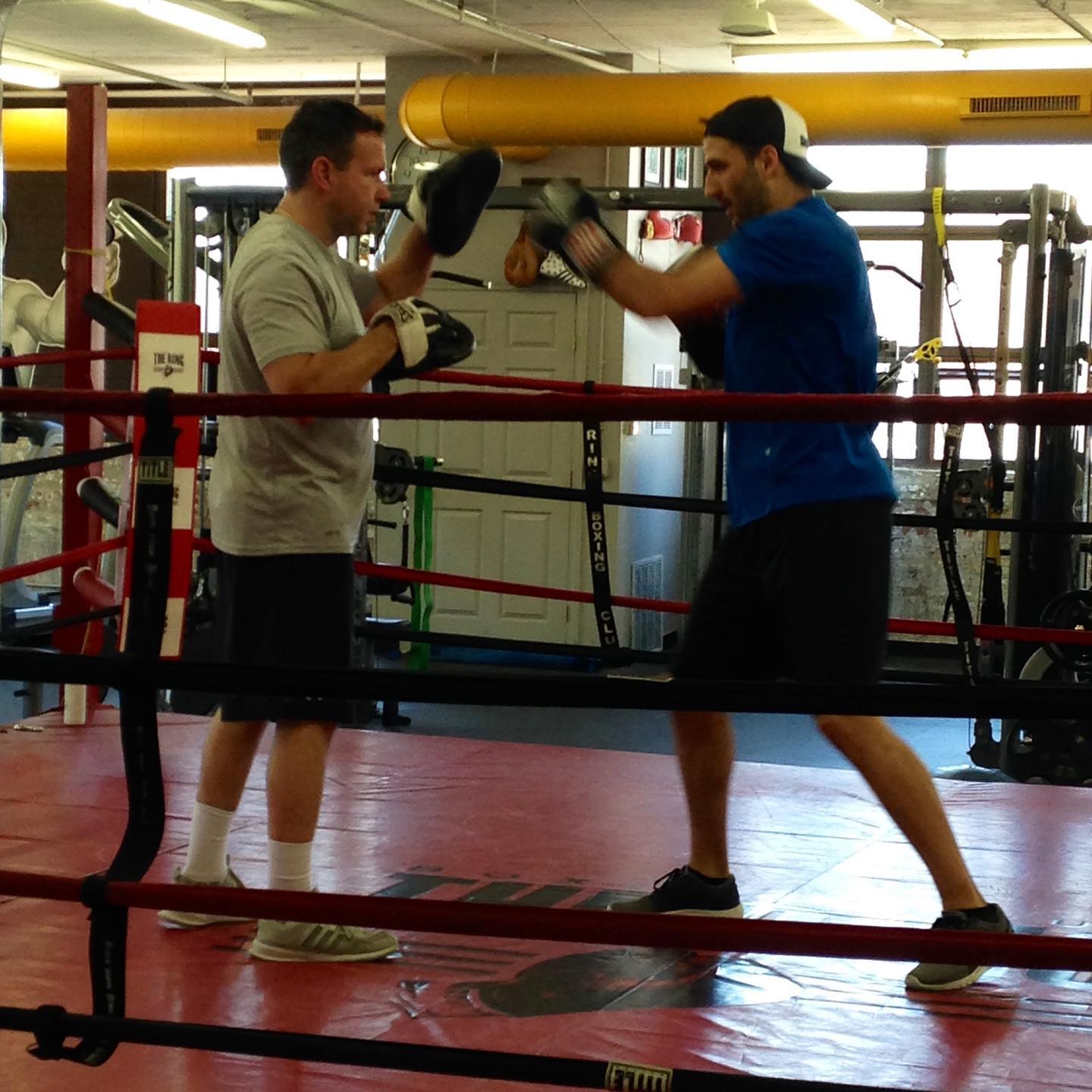 Boxing trainer @tommymcinerney Getting in that Mittwork with  @nhlbruins Patrice Bergeron .